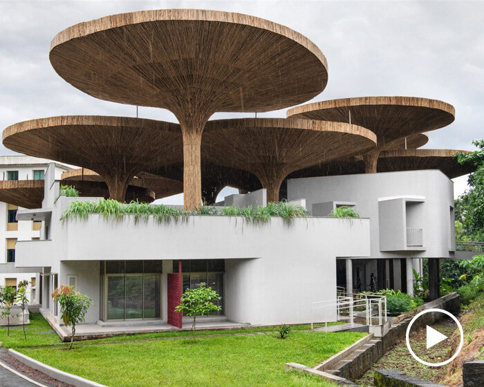 bamboo parasols crown communal hub at TAPMI campus in india by the purple ink studio