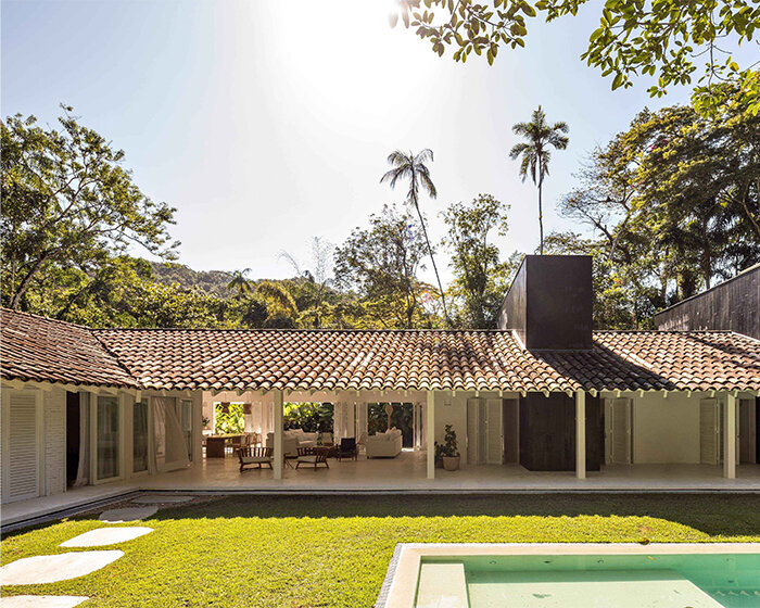 brazilian white residence unfolds under L-shaped roof in felipe hess arquitetos’ renovation