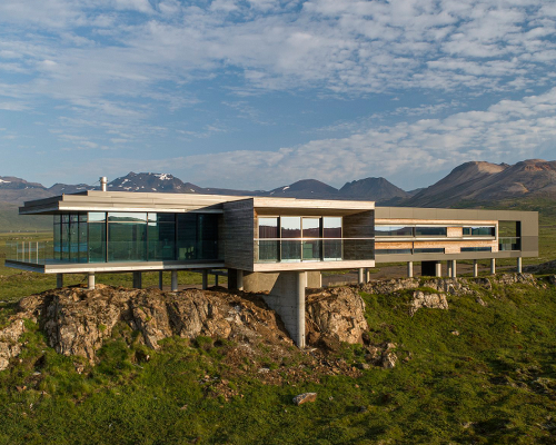 gudmundur jonsson's casa G rests on columns along mountainous icelandic landscape