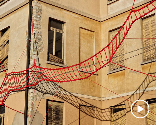 la cura threaded installation by ECO weaves across neglected elementary school in italy