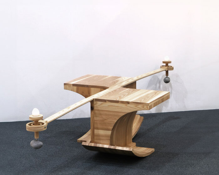 halfway serious wooden chair transforms sitting into a performative act of balance