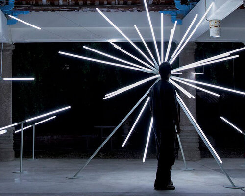 starburst installation spreads illuminating rays within temple in taiwan