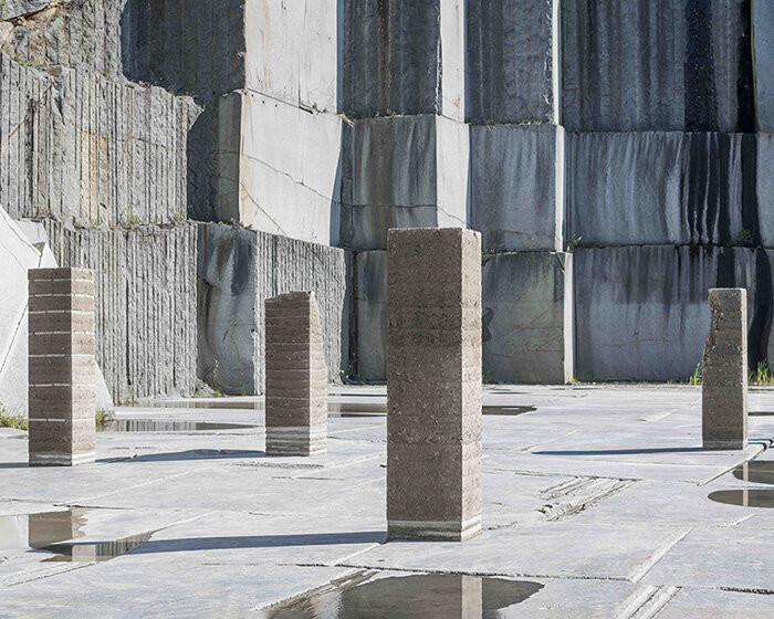 natural forces sculpt rammed earth columns in sustainable norwegian quarry installation