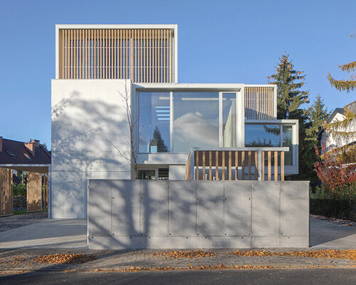 pavilion-like forms and large openings of 'weave house' shield urban views in warsaw