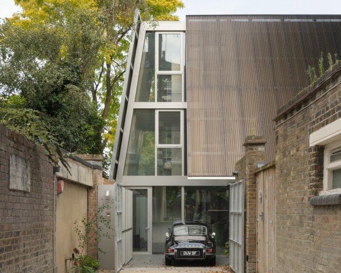 gianni botsford revitalizes london cottage, echoing its industrial norman foster extension