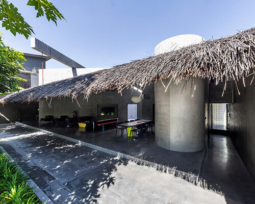 timber waffle roof shields constellation of living spaces in vietnamese residence by kientruc o