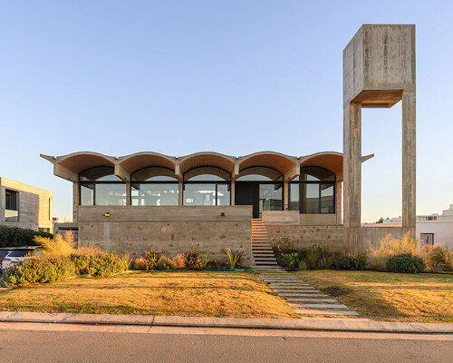 airy vaulted roofs crown robust concrete base of cristián nanzer's residence in argentina