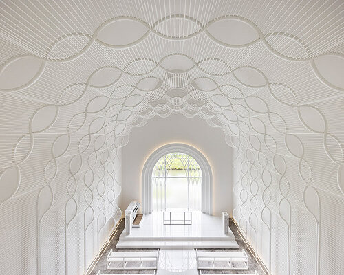 eriko kasahara sculpts delicate, undulating interiors for japan's 'st. wave' wedding chapel