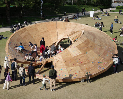 three interlocking timber rings shape TAILAND's playground pavilion in tokyo park