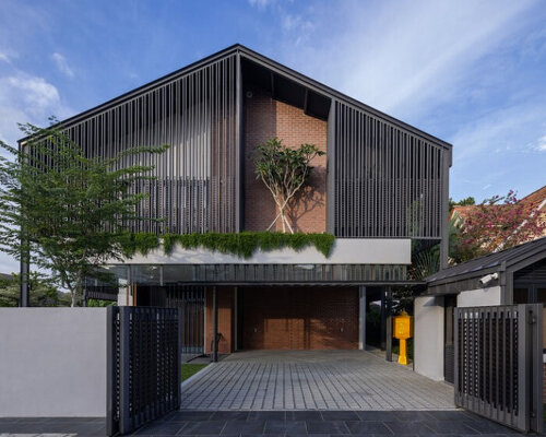 three stepped gable roofs top tebar layar house in malaysia by m j kanny