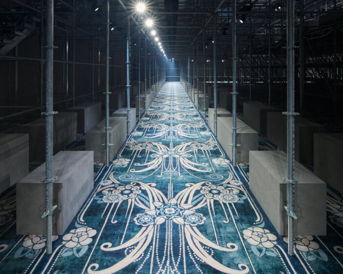 AMO surrounds prada FW25 men's show with scaffolding design & catherine martin's carpet