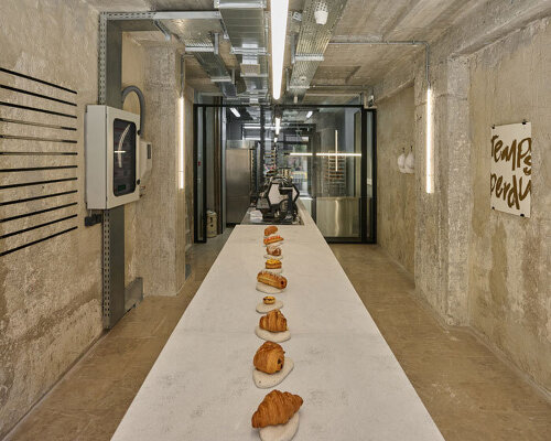 transparent facade reveals bakery's raw industrial interiors by saint of athens