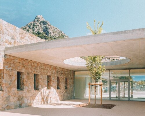 amelia tavella’s granite-carved school in corsica unfolds along the valley's contours