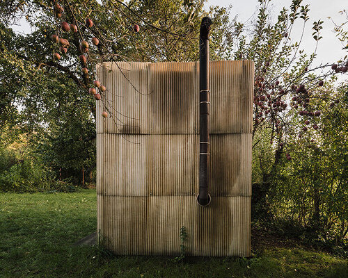 second-hand materials shape compact sauna by ika.architekti inside czech garden