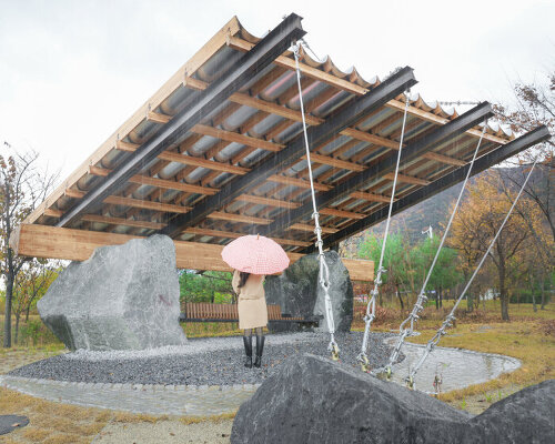 SO? rests wood & metal canopy atop rocks for 'urban interior' pavilion in south korea