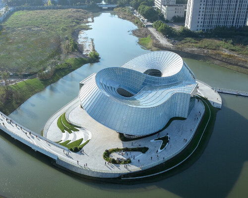 translucent interlocked rings shape aedas' jade-like yohoo museum in china