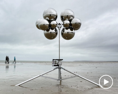 vincent leroy's kinetic mirror cloud floats between earth and sky at normandy beach