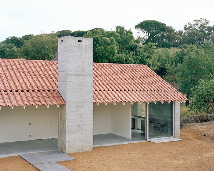 arquitectura-G combines concrete garage with residence beneath tiled roof in portugal