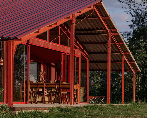 la grange rouge: tiny dwellings cluster beneath sigurd larsen's restored red barn