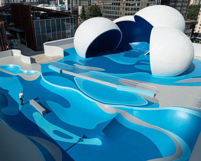 qingdao mixc rooftop skatepark's flowing curves echo ocean waves and sky